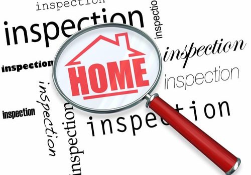 A magnifying glass hovering over the words Inspection, centering on a house with the word Home inside it