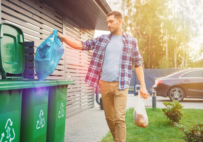 One Garbage Bag is Sorted with Biological Food Waste, Other with Recyclable Bottles Garbage Bin