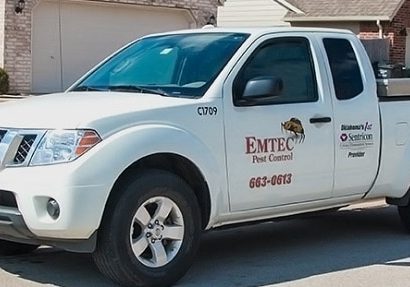 Side profile picture of Emtec Pest Control truck