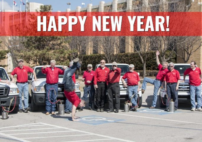 Emtec employee photo with Happy New Year banner