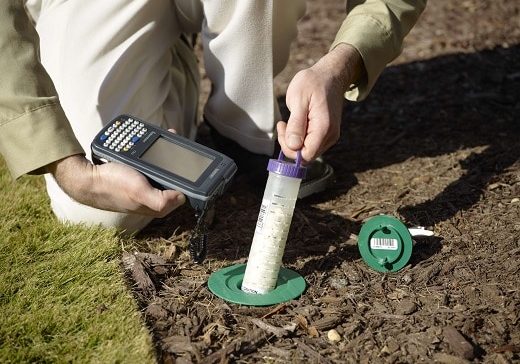 Technician checking Sentricon bait system