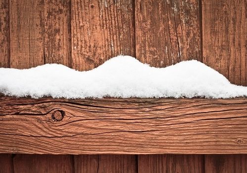 Snow on fence