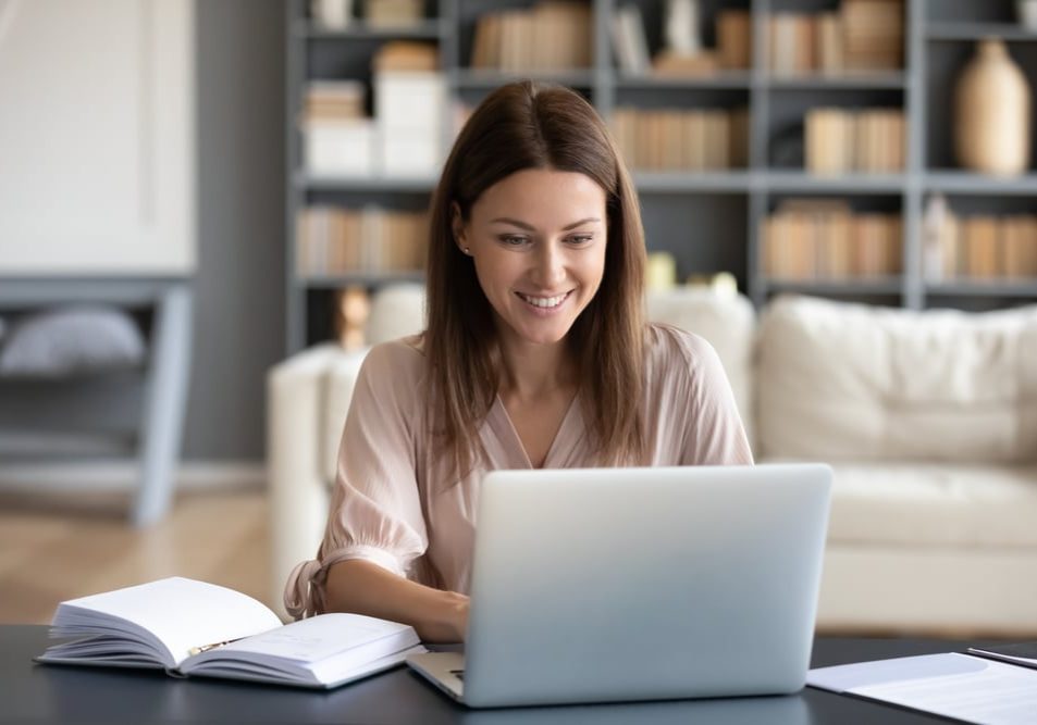 Head,Shot,Young,Happy,Woman,Sitting,At,Desk,,Working,On Head shot young happy woman sitting at desk